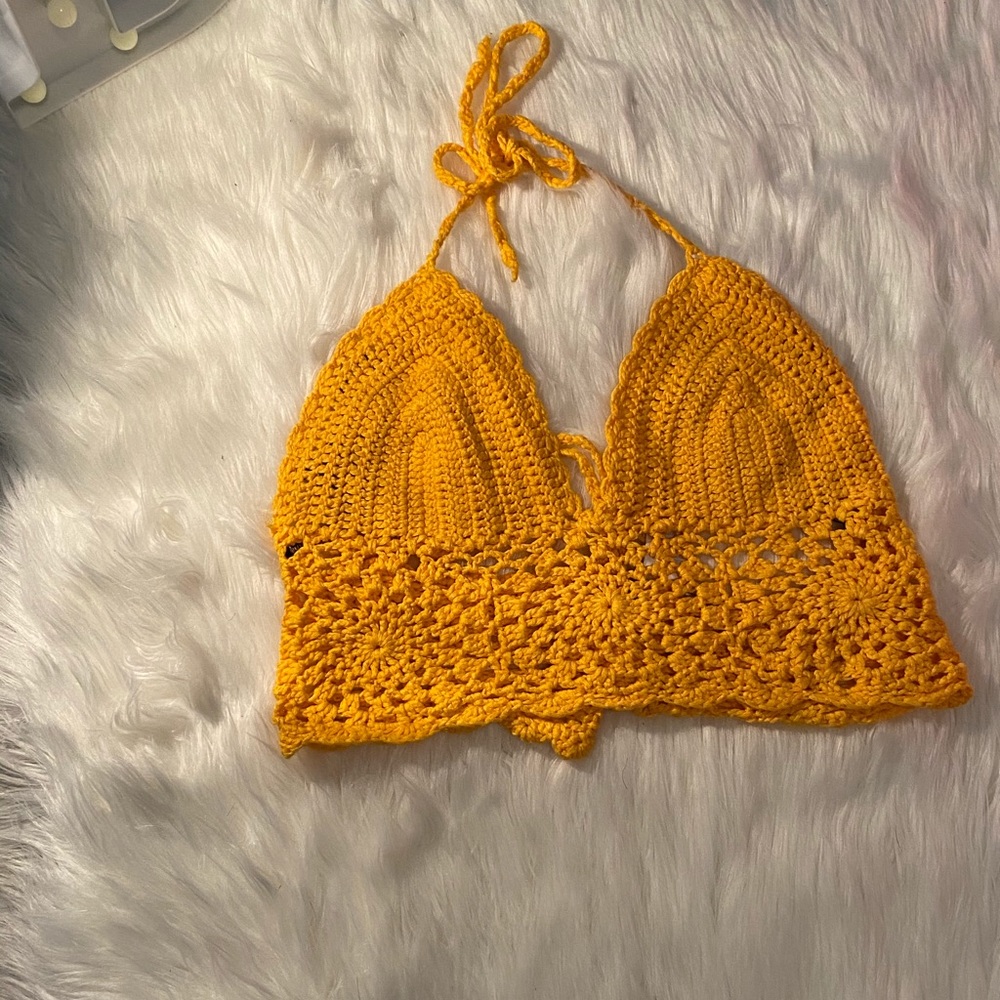 A crochet , tie up , low back crop top